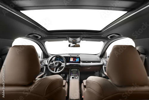A photo captured from the middle of the back seat of a modern passenger car with digital touch screen, showcasing the interior features with transparent png background