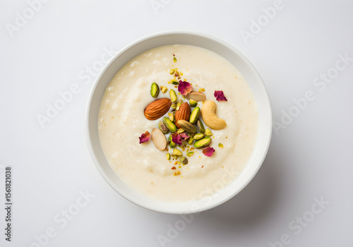 Kheer Indian Rice Pudding Dessert with Nuts and Rose Petals | Traditional Sweet Dish for Festive Occasions and Culinary Promotion