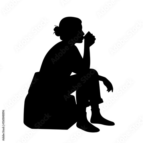 Silhouette of a woman enjoying a quiet moment with a cup of coffee. Concept of relaxation, break time, and mindfulness.
