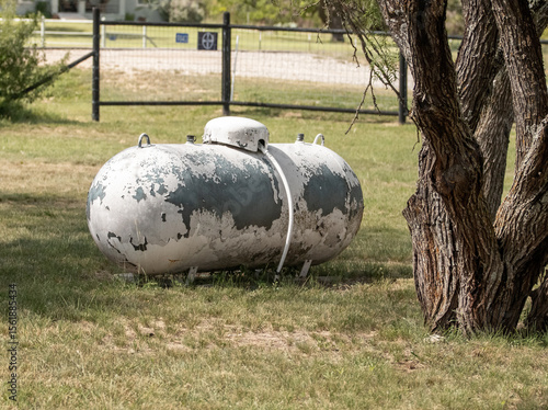 old propane tank in the years with paint coming off