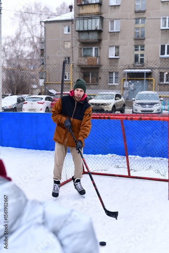 Photography People skate and play ice hockey in the yard