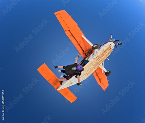 Jumping out of the orange plane with lots of adrenaline