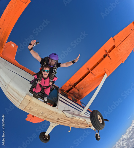 Jumping out of the orange plane with lots of adrenaline