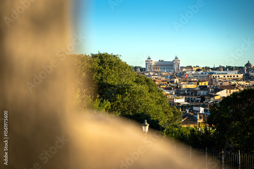 Golden hour sunset with beautiful warm cityscape of Rome, Italy.