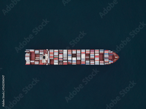 Air view of huge Container ship during underway inn open ocean. Vessel underway.