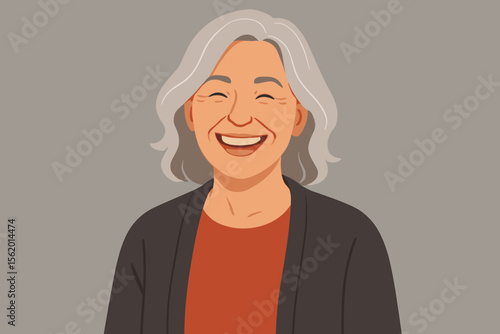 Portrait of a happy mature woman laughing. Cheerful elderly lady with grey hair and a joyful smile. Concept for positive aging, contentment, mental wellbeing and a happy retirement.