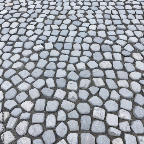 Curved gray and white stone pavement forming a radial abstract pattern