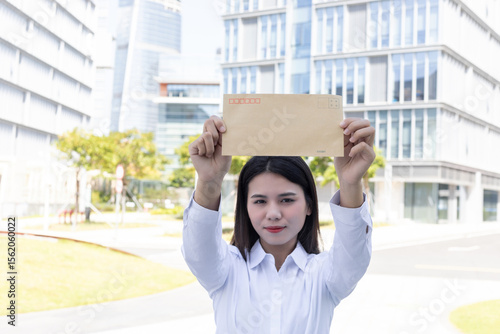 Εκτύπωση καμβά Job hunting concept: a Chinese woman holding a job application letter
