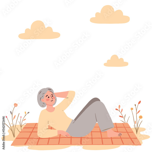 Elderly woman looking at clouds. Senior lady enjoying quiet nature moment. Peaceful old woman lying in flower field. Retired woman admiring the sky and weather. Elderly set