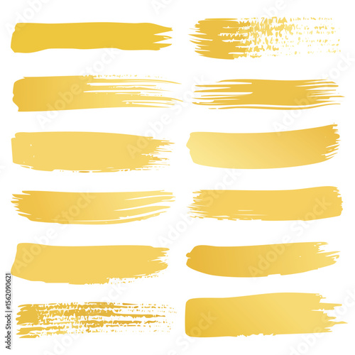 Collection of twelve gold brush stroke textures on white background paint grunge