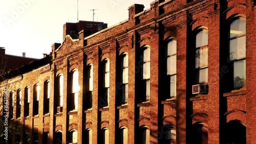 Row of old brick buildings at sunset