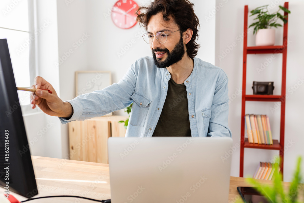 © Xavier Lorenzo - Happy professional business man working on laptop at home office. Teleworking and entrepreneur people concept. © Xavier Lorenzo - Happy professional business man working on laptop at home office. Teleworking and entrepreneur people concept.