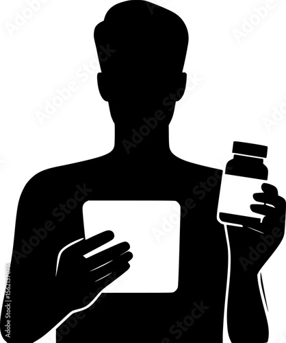Silhouette of person holding medicine bottle and reading it
