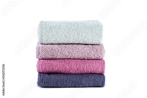 Stack of clean soft towels. Isolated on white.