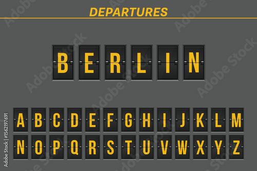 A digital display board indicates departures. The word Berlin is spelled out in bright yellow letters. Alphabet letters are shown in yellow against a dark background.