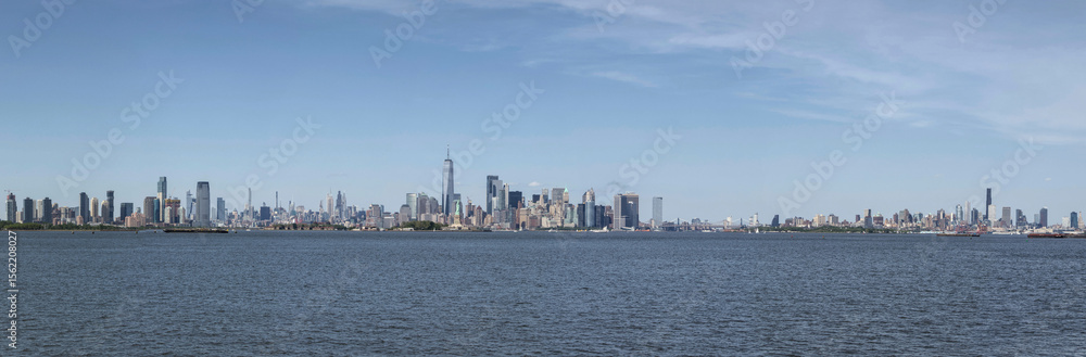 Fototapeta premium super wide angle view of new york city skyline on the hudson river with jersey city and brooklyn skyscrapers and statue harbor scene travel tourism destination manhattan nyc jc nj ny liberty state