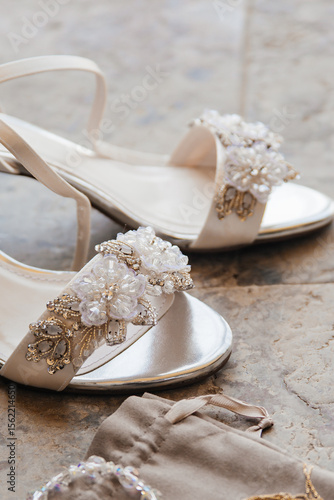 white wedding shoes on table