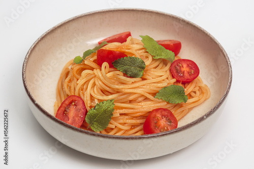 pasta with cherry tomatoes in a bowl
