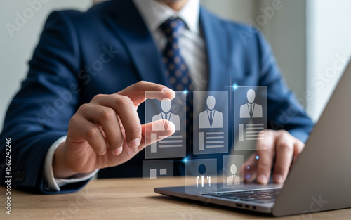 Human resource professional reviewing potential candidates using a digital interface on a laptop for recruitment and hiring.