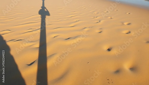 Fototapeta Naklejka Na Ścianę i Meble -  Abstract shadow cast on Baltic Sea shore, Klaipeda, Lithuania, showing unique sand patterns,  stock photo,  image