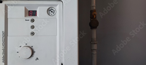 Gas Boiler Control Panel with Error Code E1. Heating System Maintenance, Utility Technology, Home Appliance