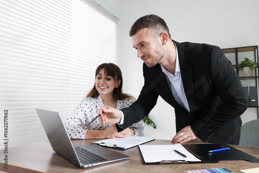 Consultant working with client at table in office. Business meeting Consultant working with client at table in office. Business meeting