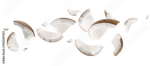 Coconut pieces fly and levitate in space. Isolated on white
