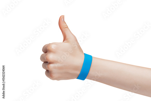 Positive hand gesture with a blue wristband.  Approval, support, or event concept.