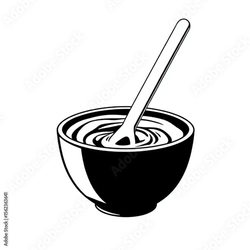 A ceramic mixing bowl with cake batter