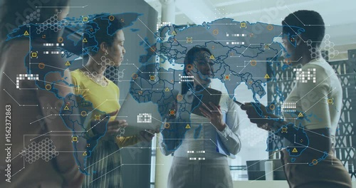 Businesswomen leaning and tapping regions after world map overlay appears, guiding decisions