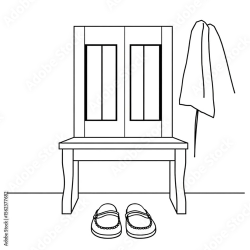 A pair of loafers under a hall bench