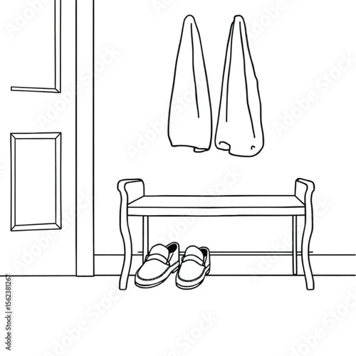 A pair of loafers under a hall bench