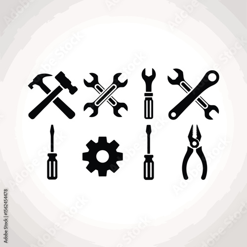 Collection of black silhouette tools including hammer wrenches screwdrivers gear and pliers