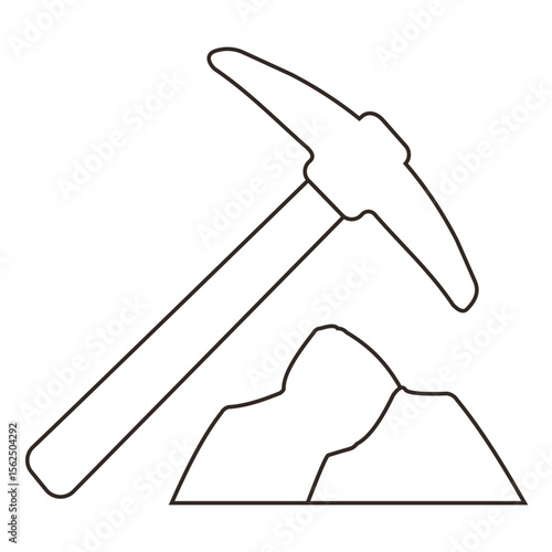 Rock hammer and boulder on a gravel surface for geological exploration