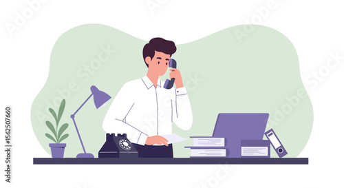 A young businessman in a white shirt sits at his office desk, attentively speaking on a landline telephone while working on a laptop and reviewing documents, showcasing a modern workspace.