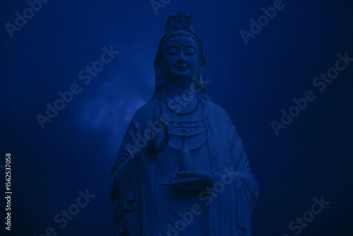 Guan Yin Statue Under a Twilight Sky