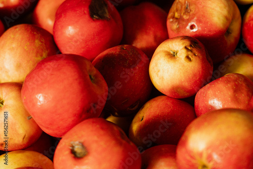 rotten red apples in a market