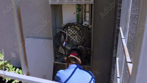 Cable technician is working at the Dmarc point