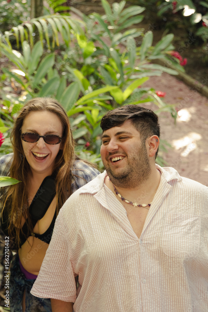 Fototapeta premium Happy Couple Laughing Together in Tropical Garden