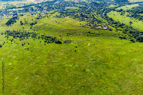 Obraz na plátně Village located on an elevation relative to the surrounding floodplain, a view f