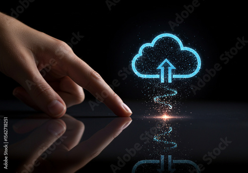 Hand pointing at glowing cloud upload icon