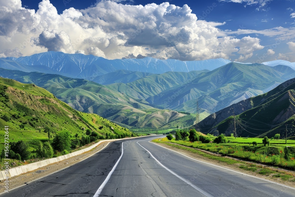 Naklejka premium Winding road through lush mountain valley under a vibrant sky