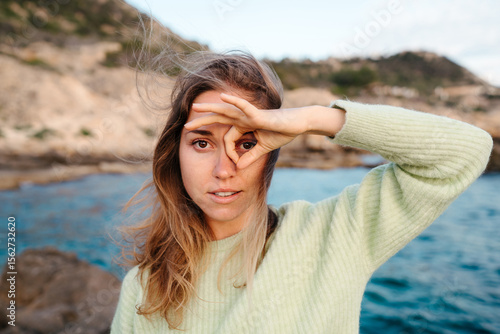 Portrait of young woman outdoors looking at camera