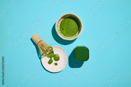 A refreshing matcha tea ceremony is depicted with traditional tools