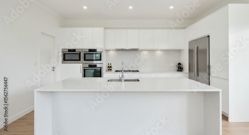 Wallpaper Mural Modern White Kitchen with Large Island and Stainless Steel Appliances in Bright Minimalist Home Torontodigital.ca