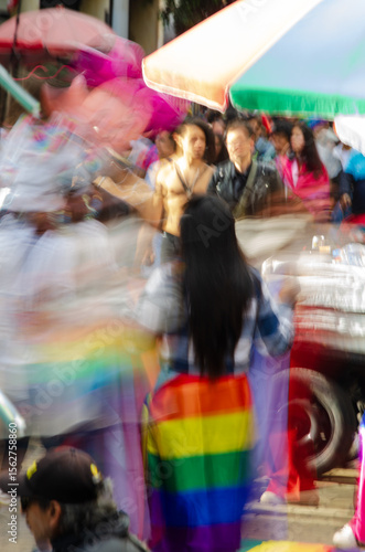 portrait shot of gathering of people at lgbt pride march at bogotá colombia taken at slow shutter speed