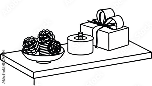 A still life arrangement featuring pine cones, a candle, and a gift box on a surface is shown here