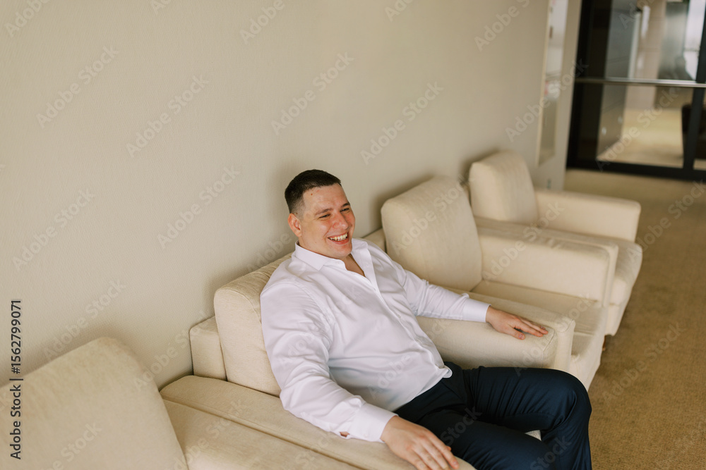 Smiling Man Sitting indoors Smiling Man Sitting indoors