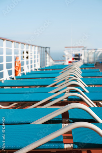  Row of Empty Lounge Chairs on Cruise Ship Deck