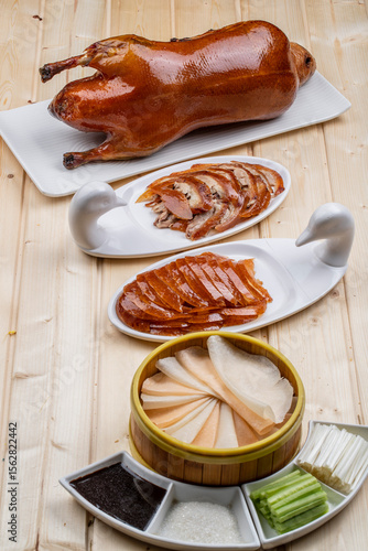 Peking duck on wooden board in sauna